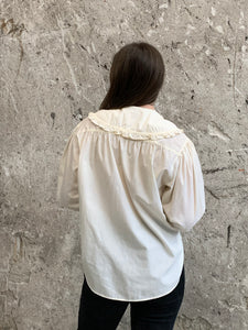 ruffled bib blouse