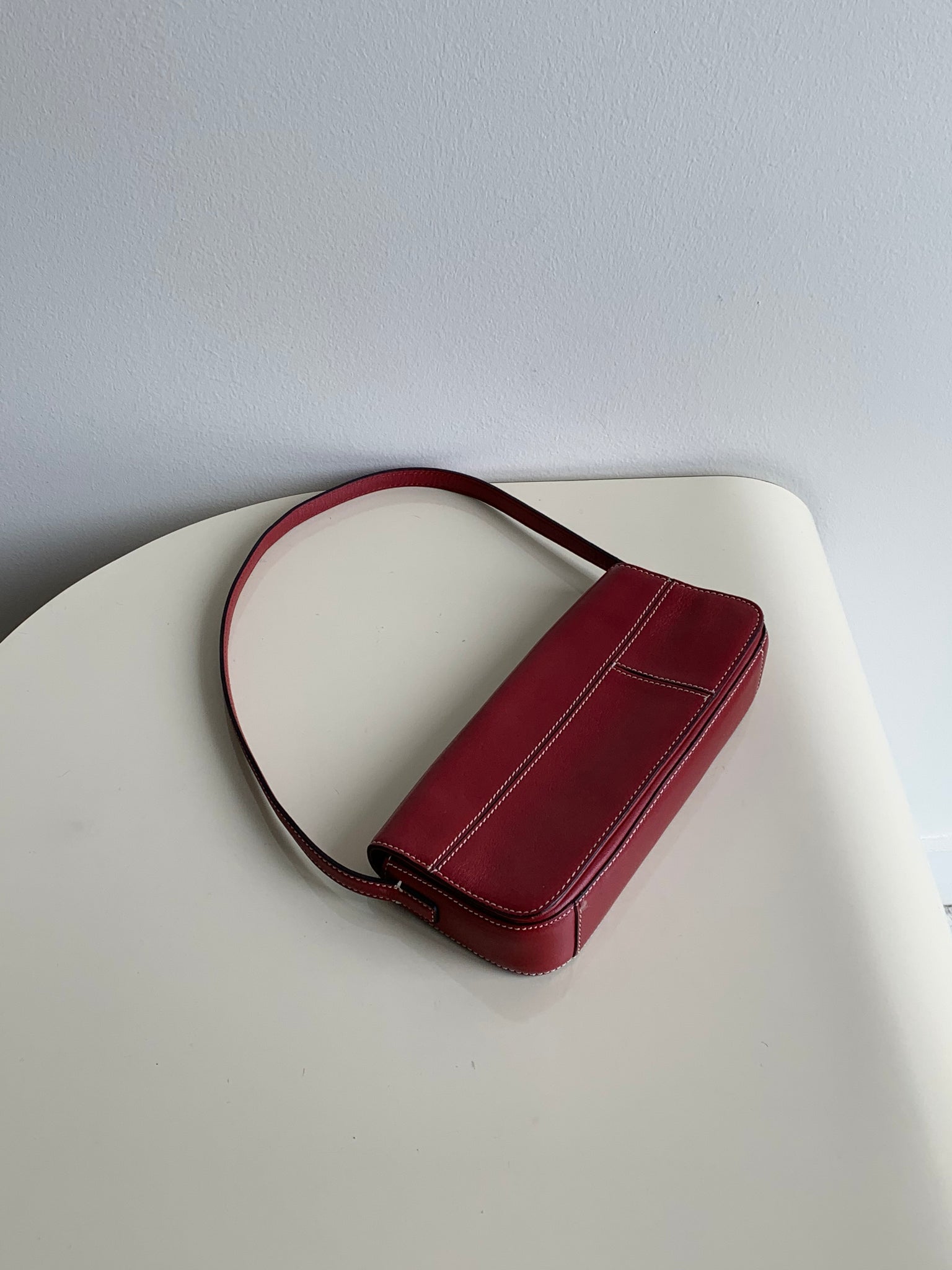 red baguette shoulder bag